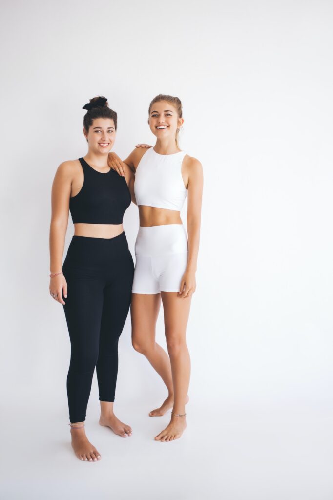 Happy fit girls reaching healthy lifestyle and body positive